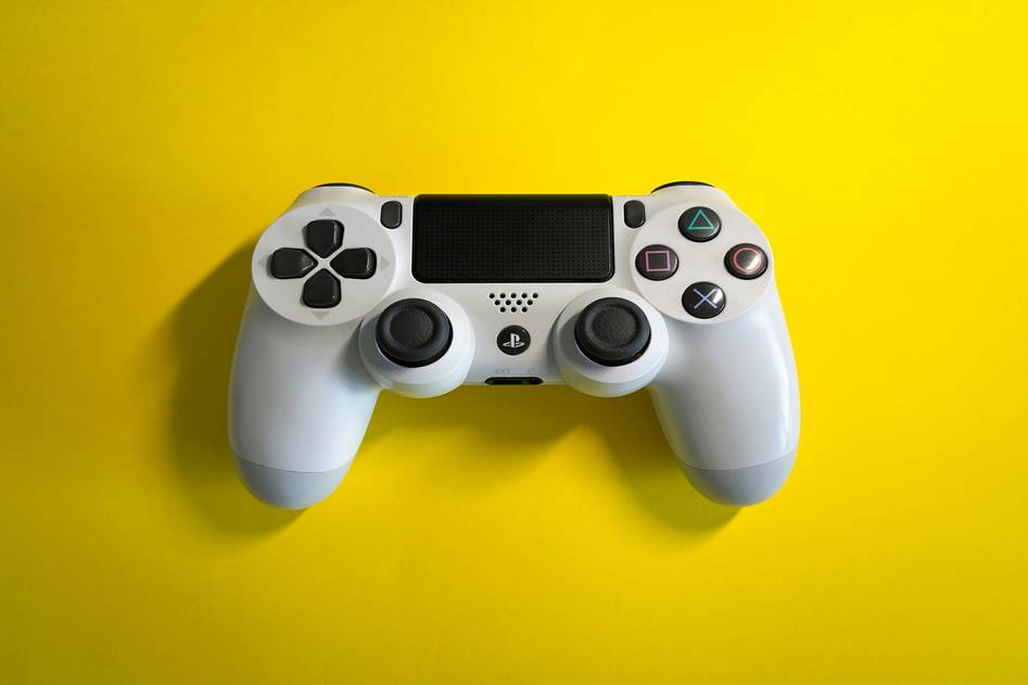 Team testing PS4 controllers in gaming setup